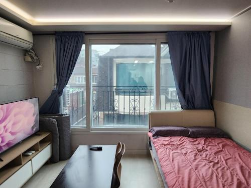 Ένα ή περισσότερα κρεβάτια σε δωμάτιο στο SG two single room near Sadang Station