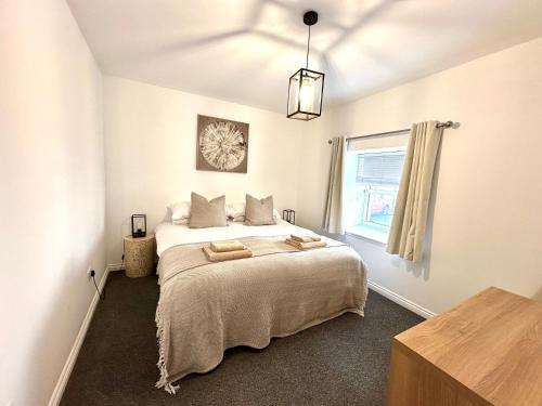 a bedroom with a large bed in a room at The Tay Residence, City Centre in Perth