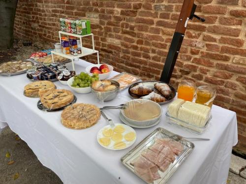 a white table with many different types of food on it at TENUTA BORGATO MORELLI in Este