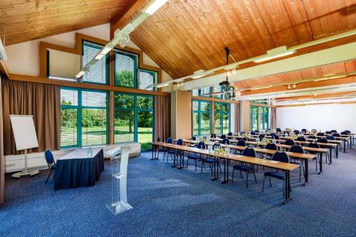 a large room with tables and chairs in it at Best Western Parkhotel Brehna-Halle in Brehna
