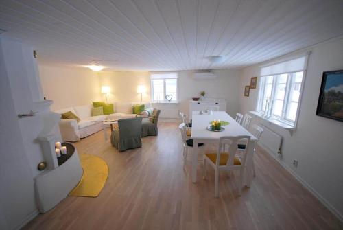 a living room with a couch and a table in a room at JON421-Skillingaryd-Galtas in Galtås