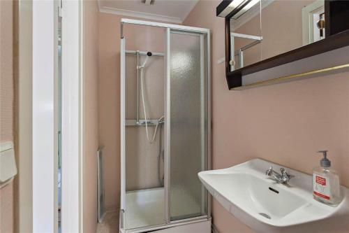 a bathroom with a shower and a sink at KRO047-Urshult-Vaesterbotorp-Bosgard in Urshult