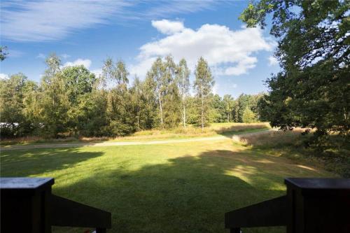 a large field of grass with trees in the background at KRO043-Urshult-Vaesterbotorp-Bosgard in Urshult