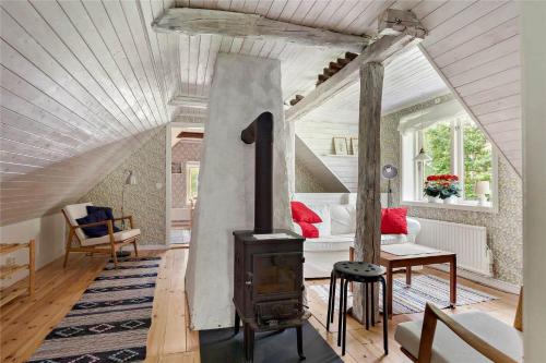 a living room with a wood stove in it at KRO384-Urshult-Vaesterbotorp-Bosgard in Urshult