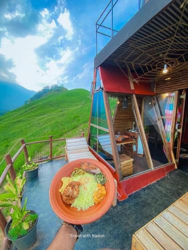 a plate of food on top of a house at prince's place cabins and camping in Badulla