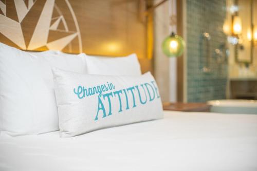 a white pillow sitting on top of a bed at Margaritaville Island Reserve Riviera Maya - An Adults Only Karisma All-Inclusive Experience in Puerto Morelos