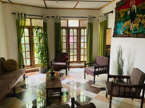 a living room with a couch and chairs at Shalom place in Bandarawela