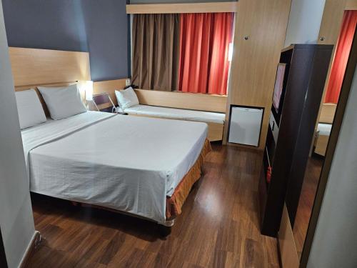 Postel nebo postele na pokoji v ubytování Ibis Mossoro