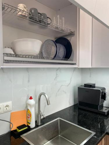 Η κουζίνα ή μικρή κουζίνα στο Cappuccino Apartment in new building