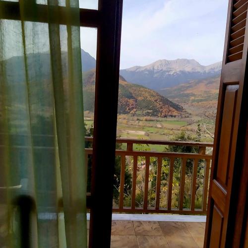 a view from the door of a balcony with mountains at Hotel Semeli in Goura