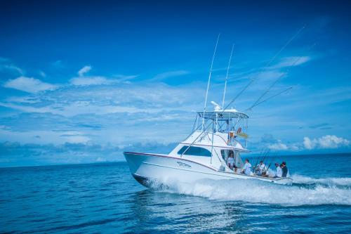 a group of people on a boat in the water at Colina 5D 3 bdr Garden View in Los Suenos in Herradura