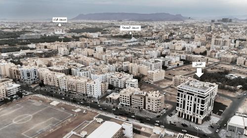 an aerial view of a city with tall buildings at Lumian Hotel in Al Madinah