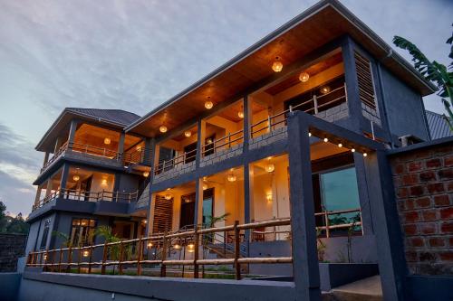 a large house with lights on the side of it at Samora River Lodge in Arusha