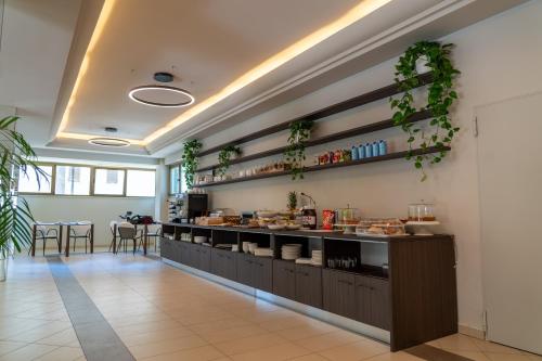 a kitchen with a counter with food on it at Hotel Ulisse in Marina Romea