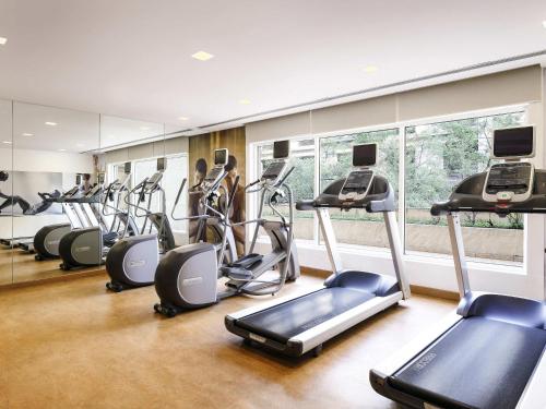 a gym with a bunch of exercise bikes in it at ibis Pune Viman Nagar - An Accor Brand in Pune