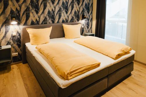 Postel nebo postele na pokoji v ubytování Hotel Rabenstein