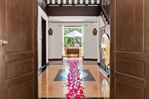 a christmas tree in the hallway of a house at Paradise Island Estate in Choeng Mon Beach