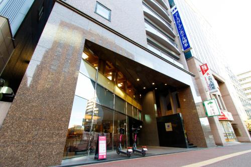 a store front of a building with a large window at Mars Garden Hotel Hakata in Fukuoka