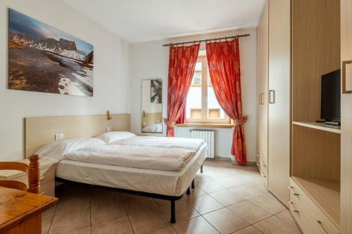 En eller flere senge i et værelse på Hotel Aquila