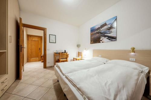 En eller flere senge i et værelse på Hotel Aquila