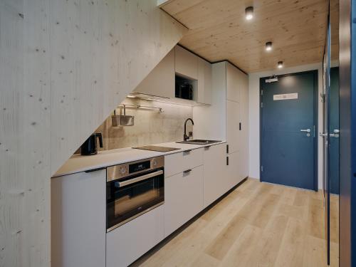 Una cocina o cocineta en Sume by Larsen