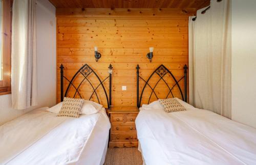 Un ou plusieurs lits dans un hébergement de l'établissement Chalet Chocolat Chatel