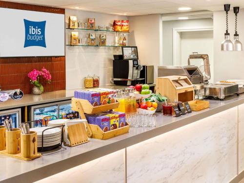 a kitchen with a counter with food on it at ibis budget Leicester in Leicester