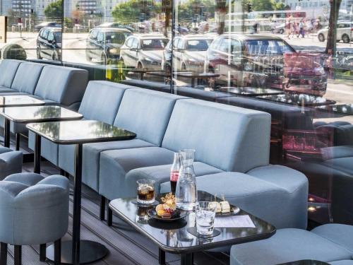 a row of tables and chairs in a restaurant at SO/ Vienna in Vienna