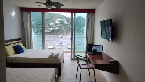 TV a/nebo společenská místnost v ubytování Hotel Bahia Taganga