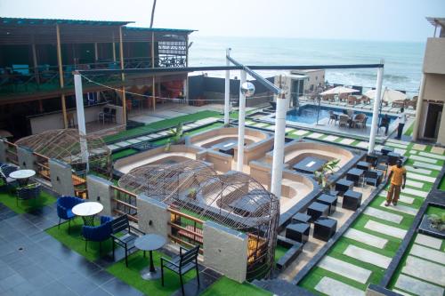 an overhead view of a building with a swimming pool at Xcape Beach Club in Cape Coast