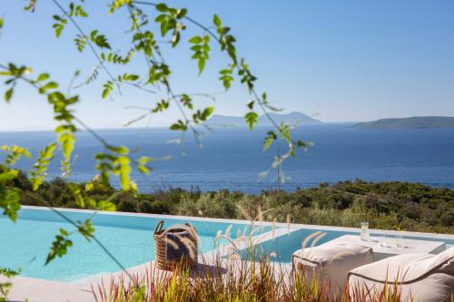 a villa with a view of the ocean at Cloud Nine Villa in Évyiros