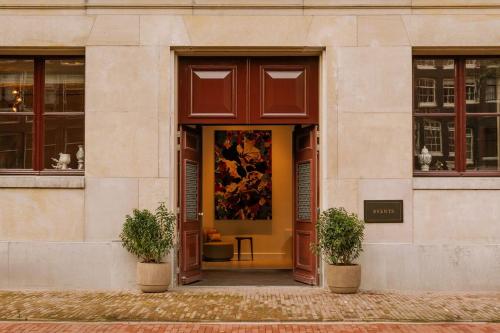 a large painting on the door of a building at Rosewood Amsterdam in Amsterdam
