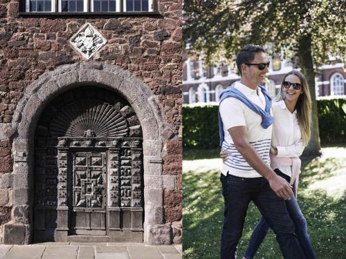a man and a woman standing in front of a gate at Mercure Exeter Southgate Hotel in Exeter