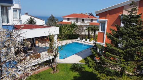 an aerial view of a house with a swimming pool at Treekos Suite Hotel Istanbul Airport in Arnavutköy