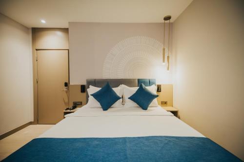 Ένα ή περισσότερα κρεβάτια σε δωμάτιο στο Echinus Blue Hotel