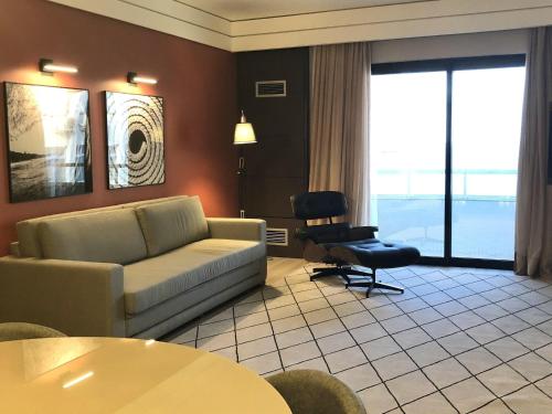 Ein Sitzbereich in der Unterkunft Mercure Camboriu