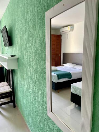 Apart-Hotel "Encantos do Mar" - Beira Marにあるベッド