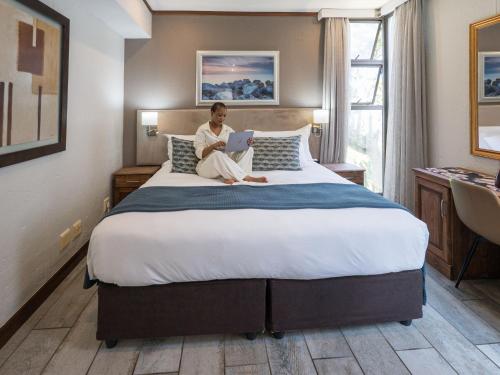 Postel nebo postele na pokoji v ubytování ANEW Hotel Ocean Reef Zinkwazi