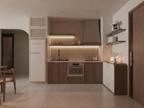 a kitchen with brown cabinets and a white refrigerator at SOHO Suites - Saigon Central, 5-Min-To-Bui Vien Street in Ho Chi Minh City