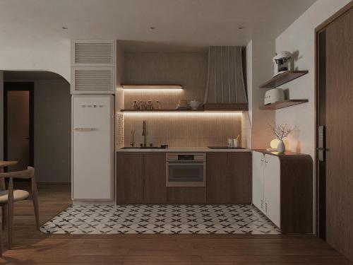 a kitchen with a refrigerator and a stove at SOHO Suites - Saigon Central, 5-Min-To-Bui Vien Street in Ho Chi Minh City