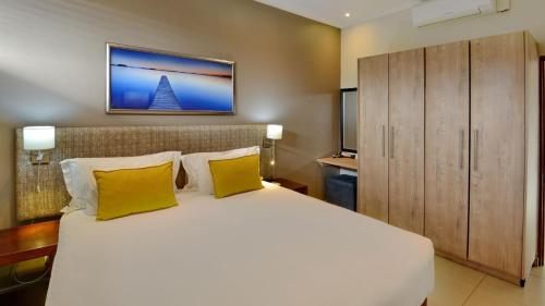 Postel nebo postele na pokoji v ubytování ANEW Hotel Ocean Reef Zinkwazi