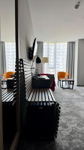 a living room with a bench in a building at ibis Styles Warszawa City in Warsaw