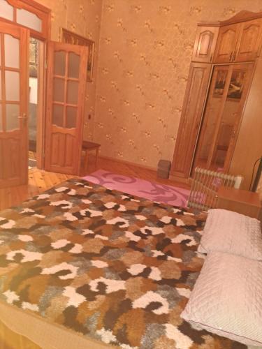 a bedroom with a bed in a room at Квартира in Baku