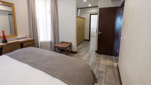 Postel nebo postele na pokoji v ubytování ANEW Hotel Ocean Reef Zinkwazi