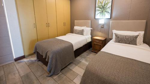 Postel nebo postele na pokoji v ubytování ANEW Hotel Ocean Reef Zinkwazi
