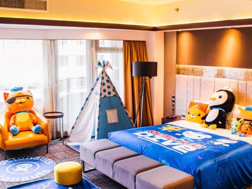a bedroom with a bed with a toy tent at Grand Mercure Shanghai Hongqiao in Shanghai