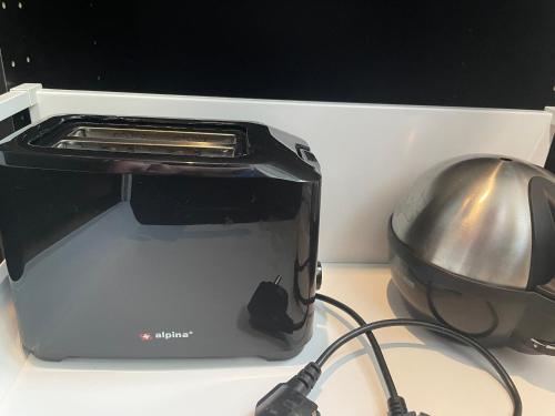 a toaster oven sitting on top of a counter at Puiestee apartment in Valga