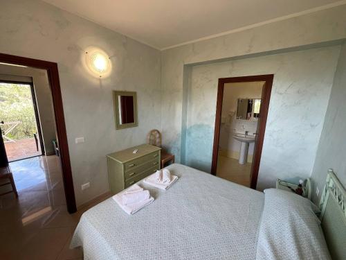 Postel nebo postele na pokoji v ubytování Agriturismo Cally Cally