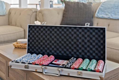 a box of dominoes sitting on top of a table at Near Red Rocks with Hot Tub, Fire Pit and Views in Indian Hills