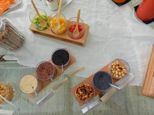 a table topped with bowls of different types of food at Poggio Piglia in Chiusi